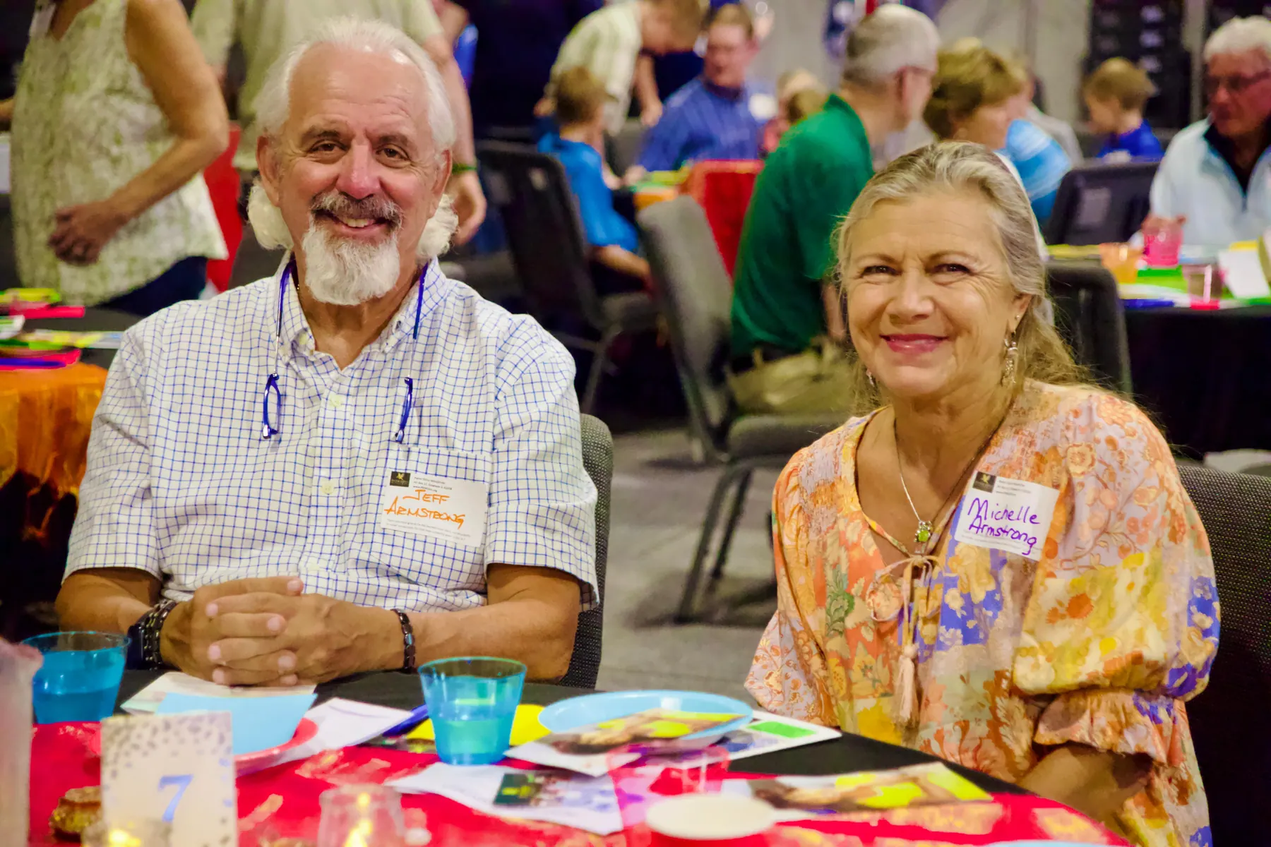 Two friends sharing a moment at the benefit