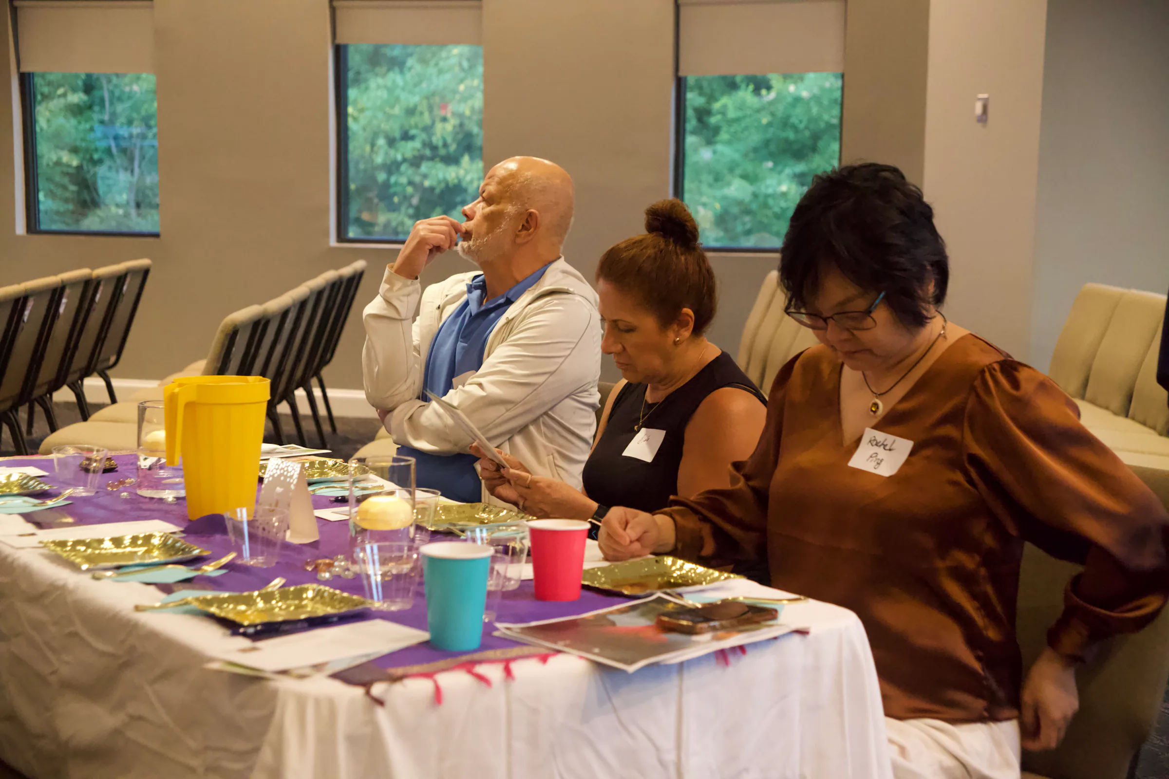 Guests reading the program at their table