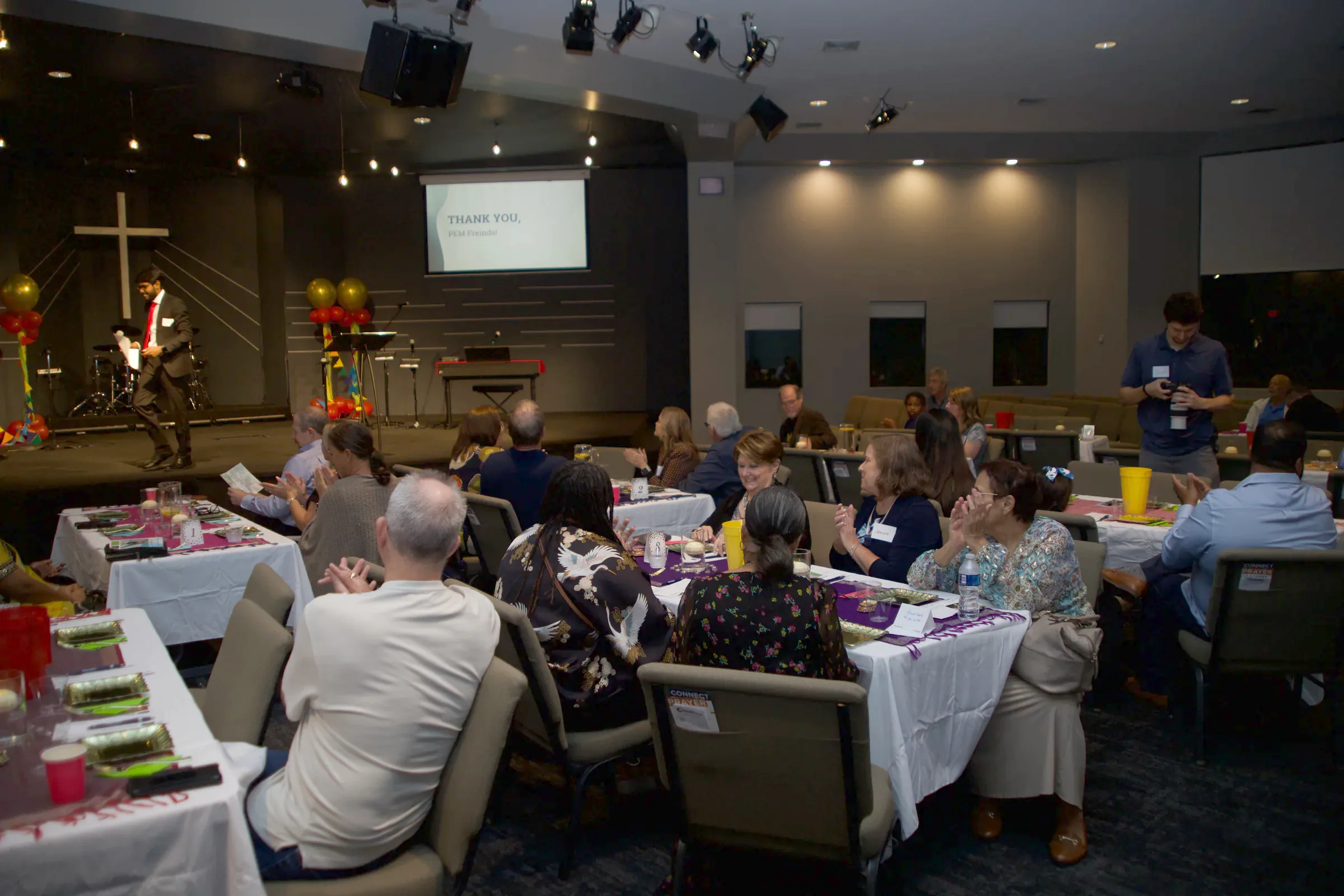 Guests applauding from their tables