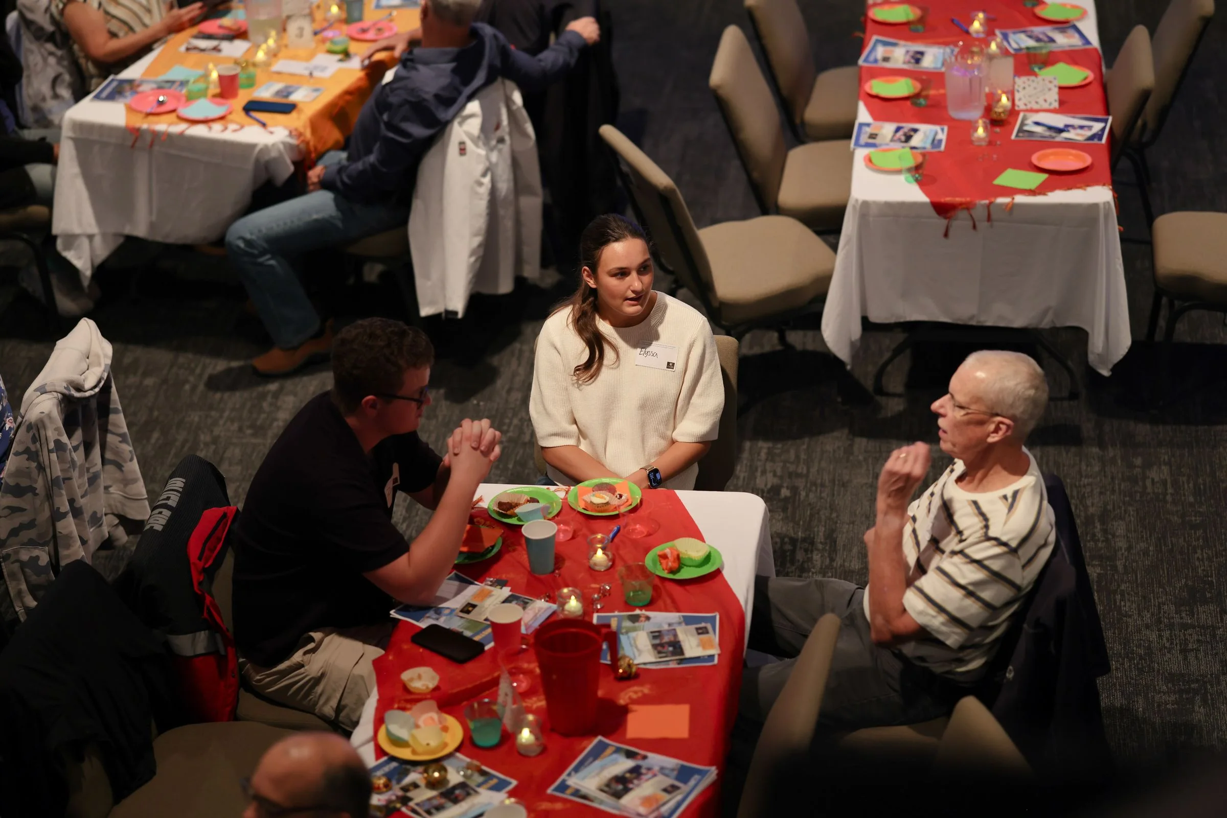 Guests talking at their tables, seen from above